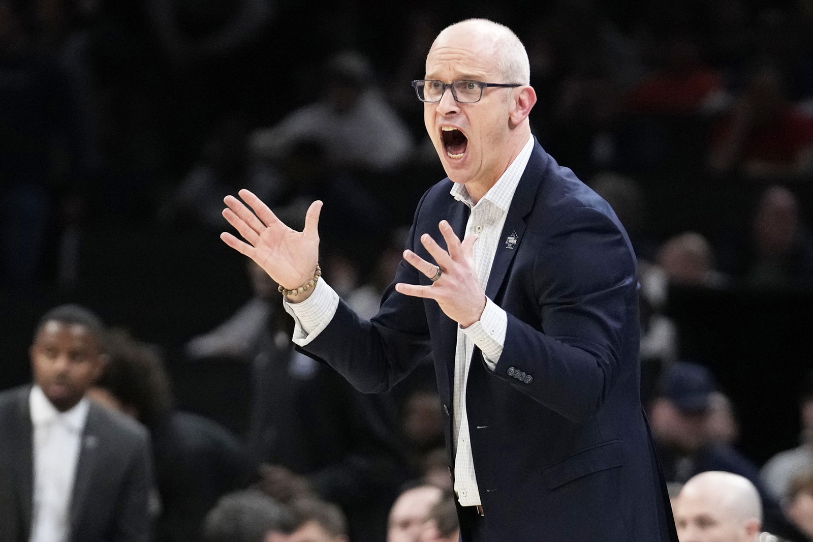UConn head coach Dan Hurley calls towards his players during the first half of the Elite 8 game against Illinois in the men’s NCAA Tournament on March 30 in Boston.