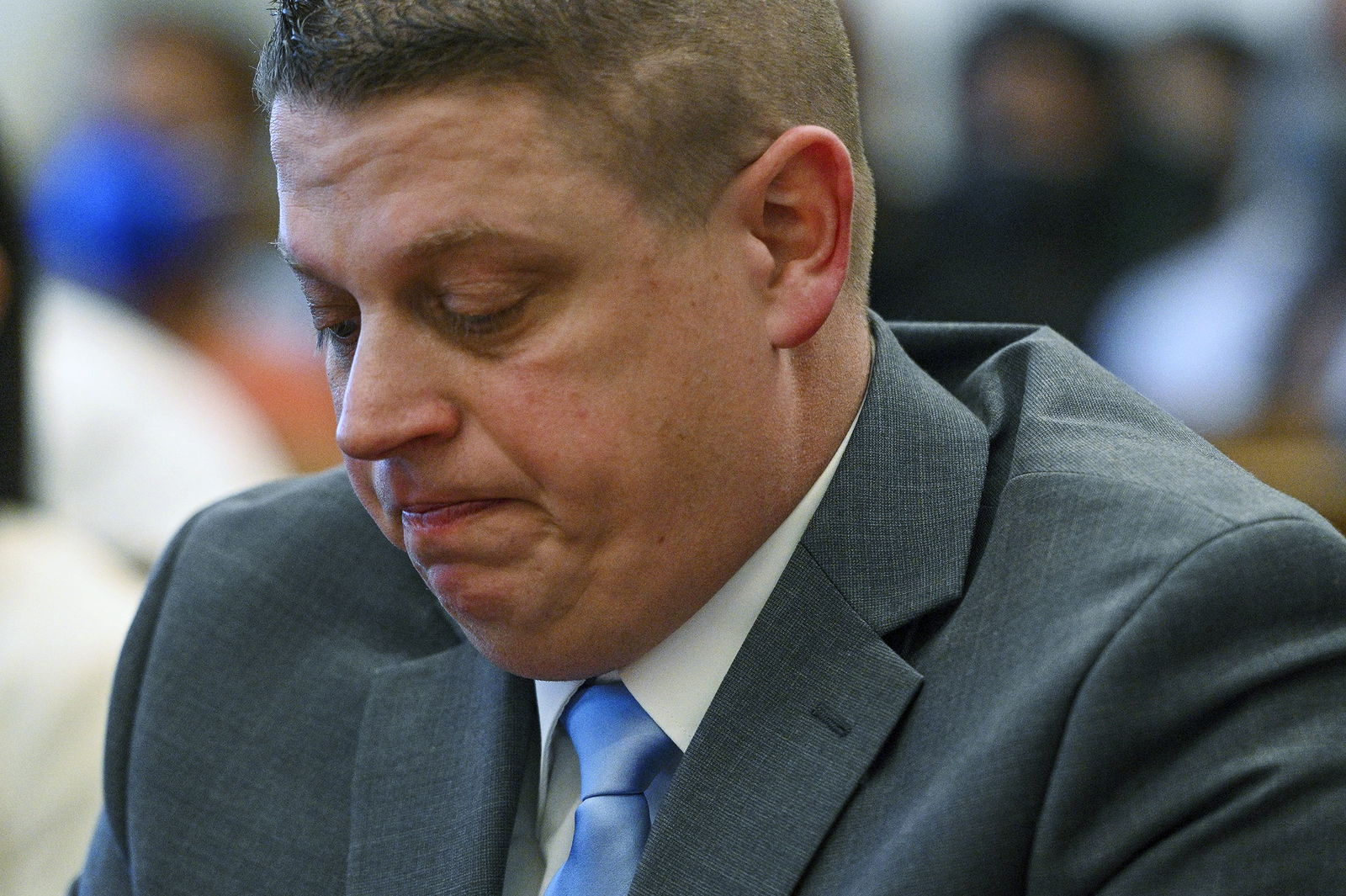 Former Kansas City police detective Eric DeValkenaere listens to witness statements during his sentencing hearing