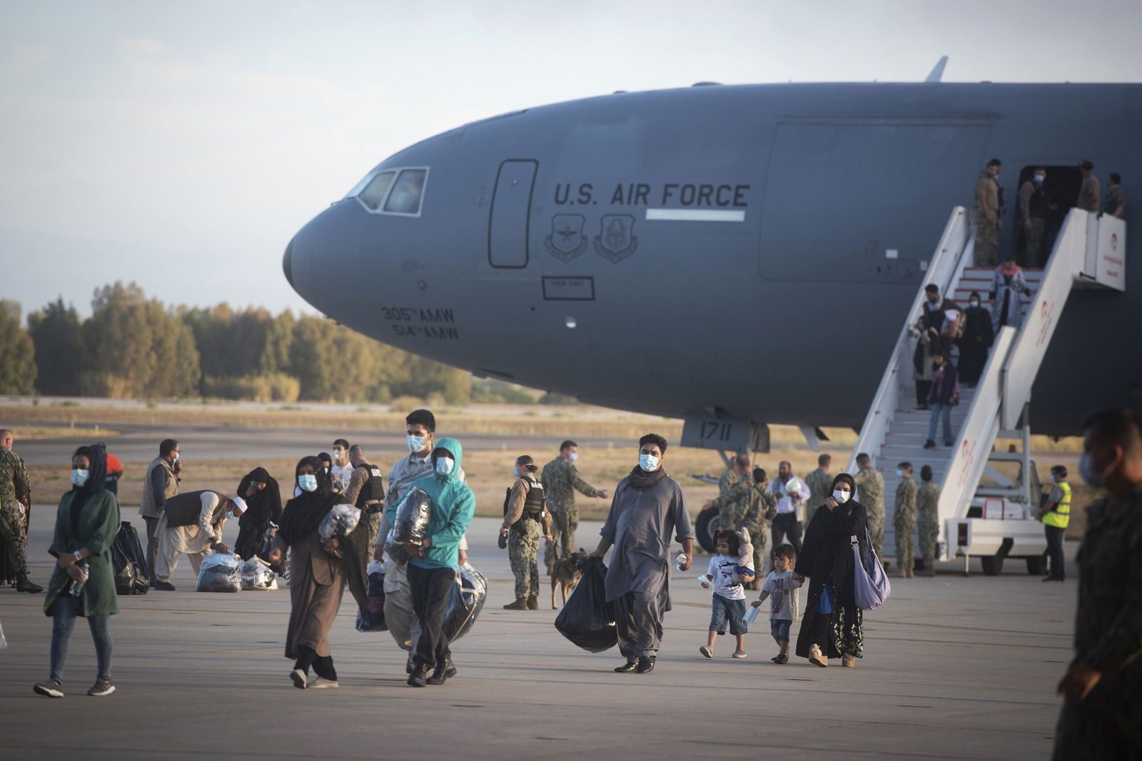 Evacuees from Afghanistan disembark from a U.S. Air Force plane in 2021 at the Naval Station in Rota
