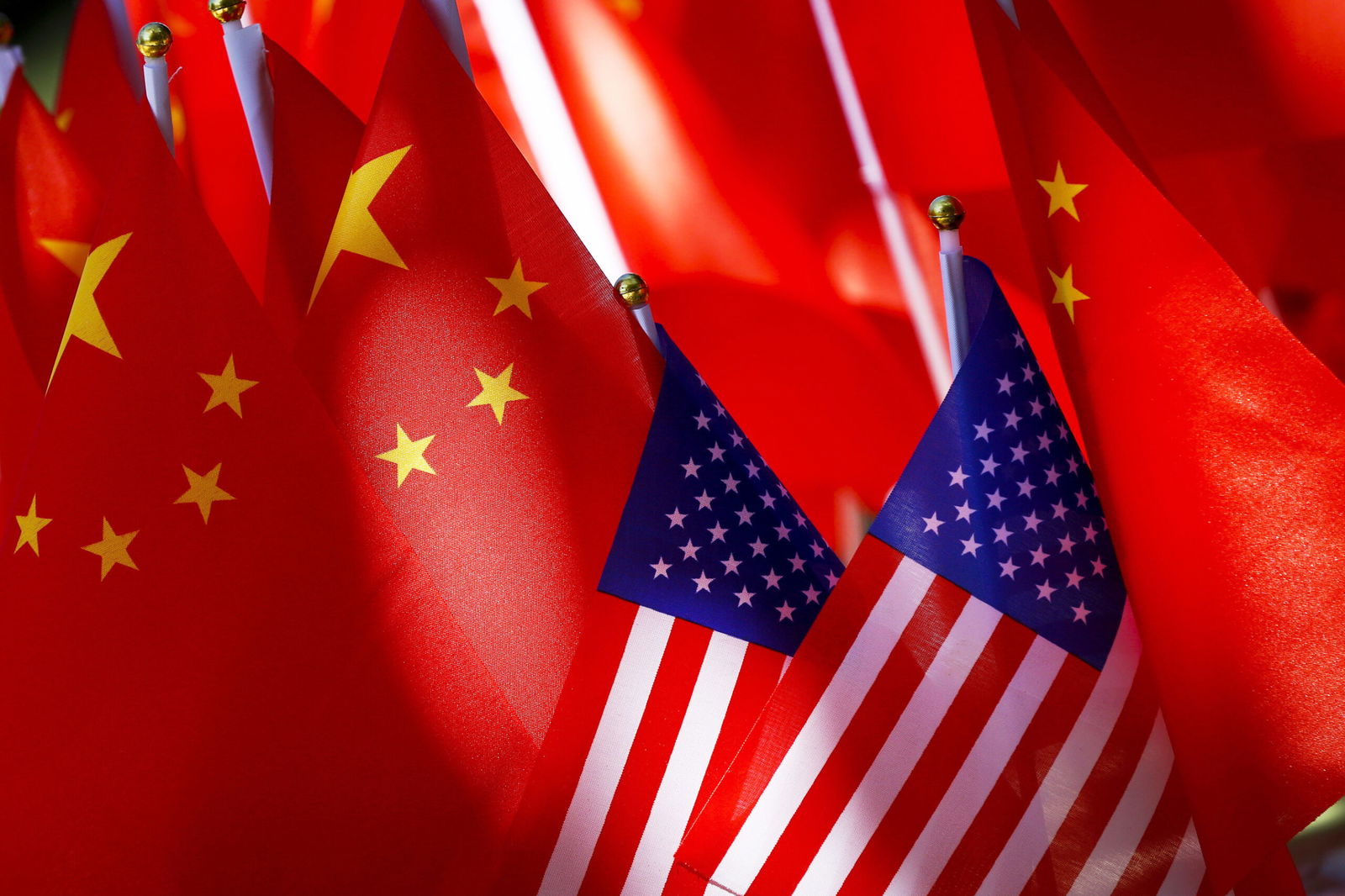 American flags are displayed with Chinese flags on top of a trishaw in Beijing.