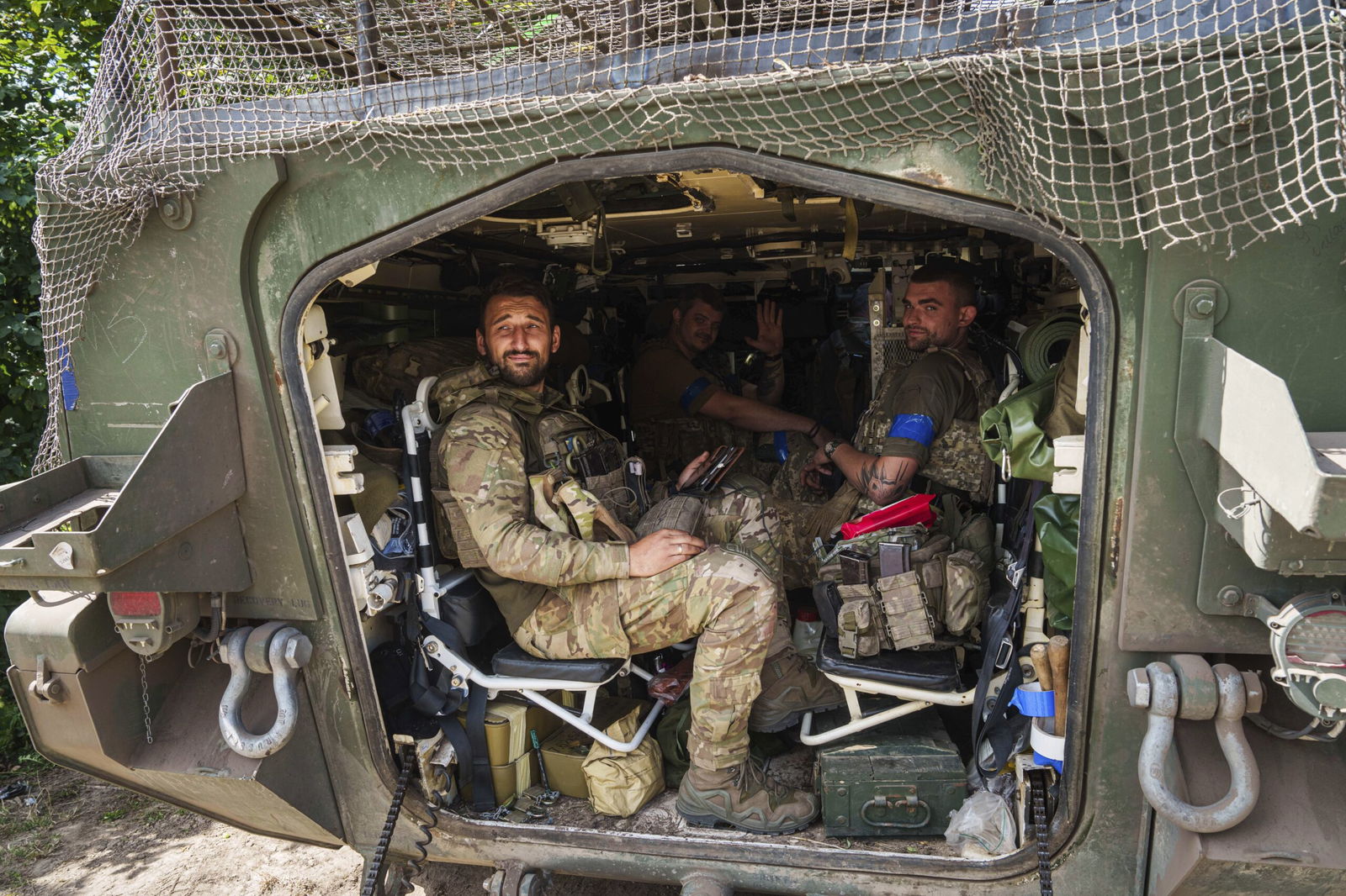 Ukrainian servicemen sit inside their APC after returning from the Russian Kursk region on Wednesday near the Russian-Ukrainian border