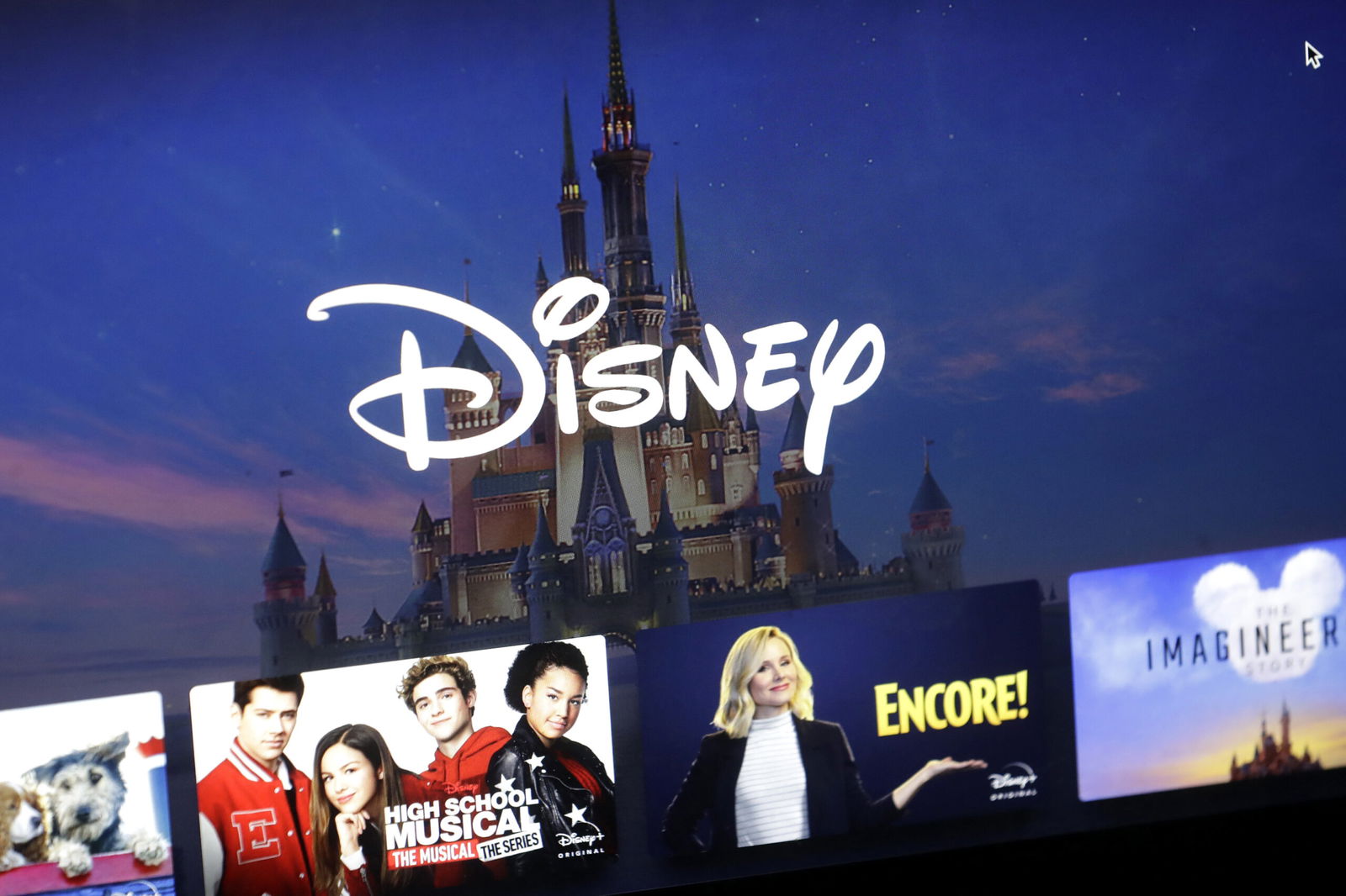 A Disney logo forms part of a Disney Plus menu on a computer screen.