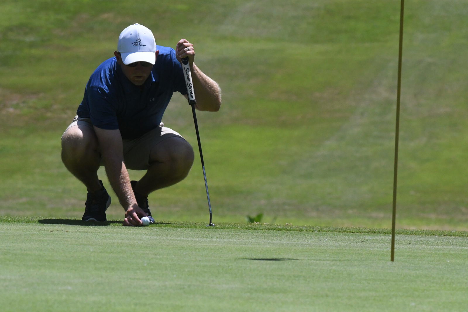 Local golfer Greg Diederich reads the green during the first round of the Fairview Championship in 2019 at Fairview Golf Course.