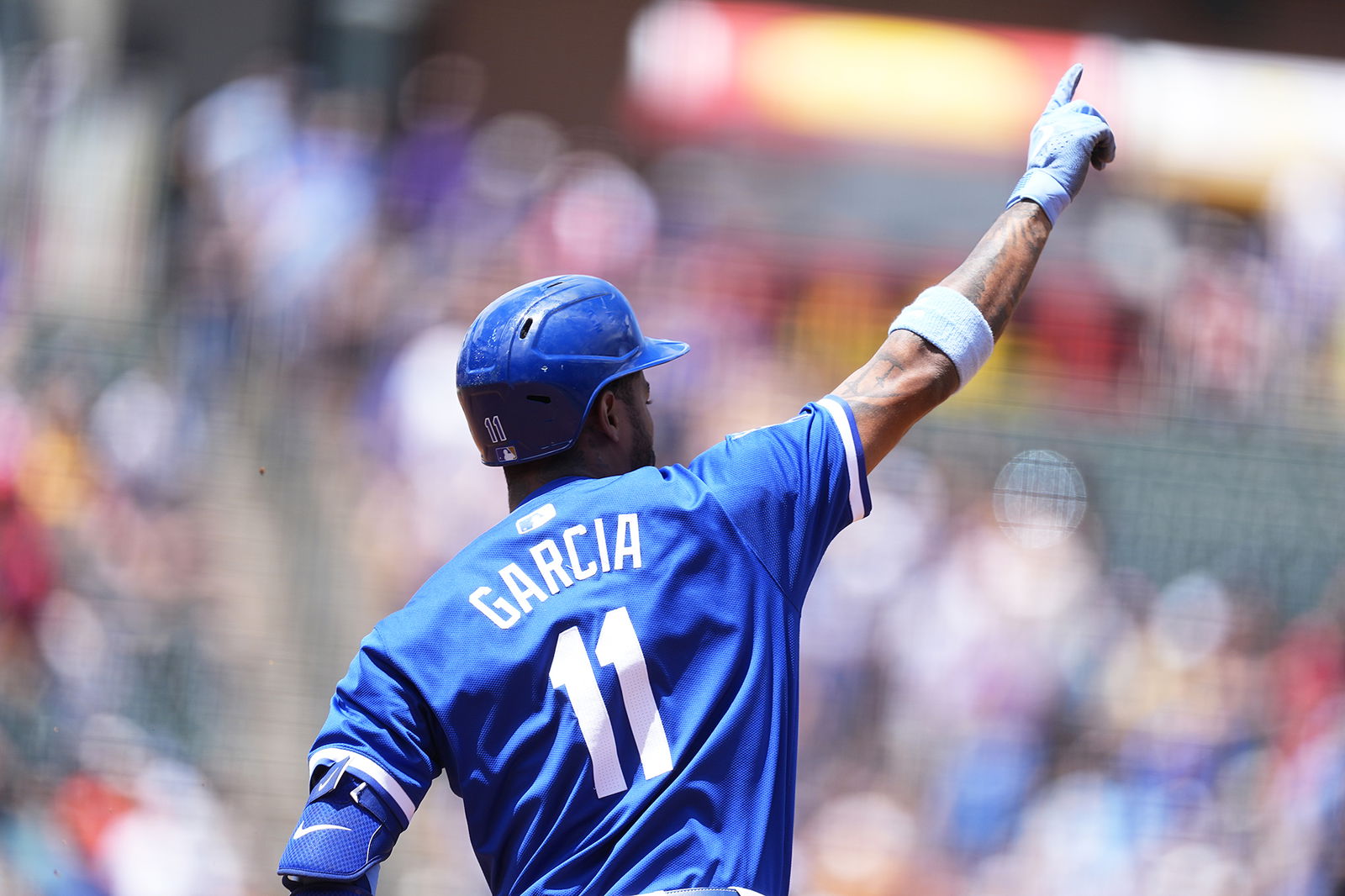 Kansas City Royals’ Maikel Garcia gestures to the bullpen as he circles the bases after hitting a three-run home run off Colorado Rockies starting pitcher Tanner Gordon in the second inning Sunday in Denver.