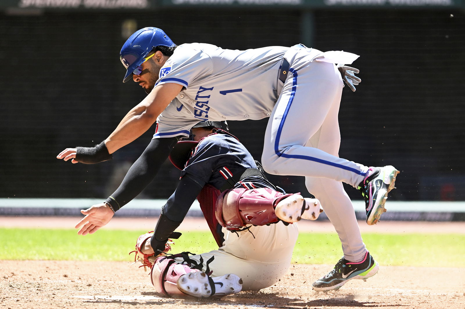 Kansas City Royals’ MJ Melendez scores over Cleveland Guardians catcher Bo Naylor on a fielder’s choice hit by Kyle Isbel during the sixth inning Thursday in Cleveland.