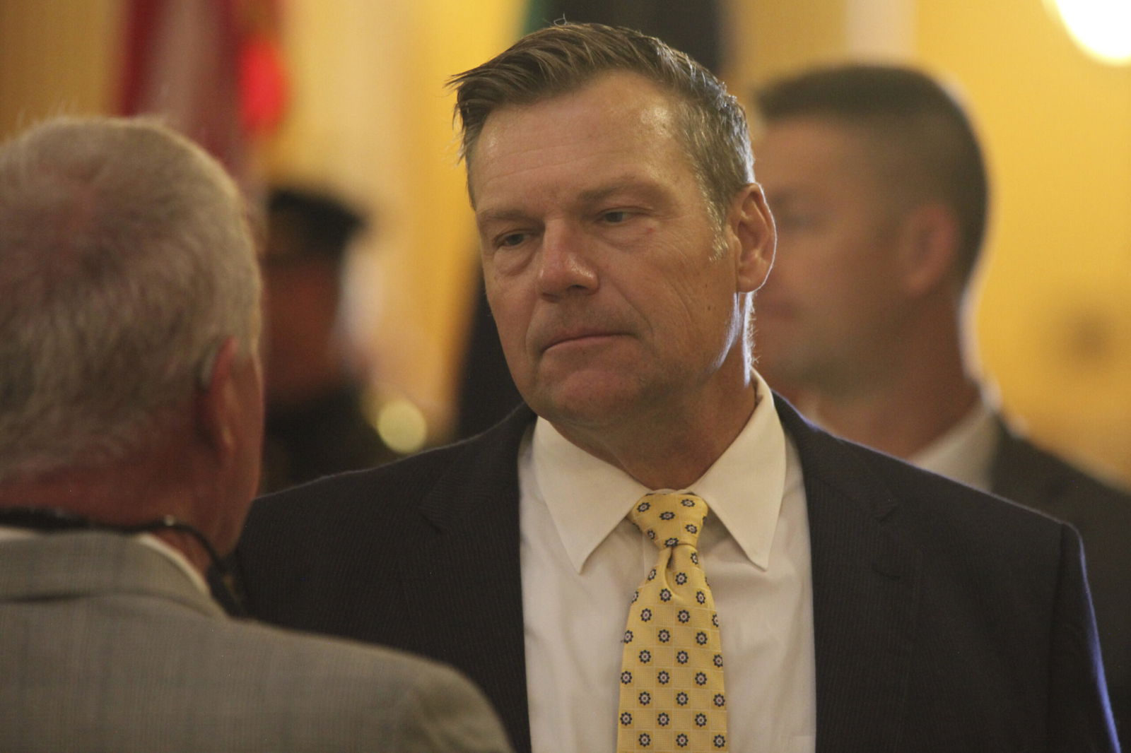 Kansas Attorney General Kris Kobach participates in a ceremony honoring fallen law enforcement officers at the Statehouse