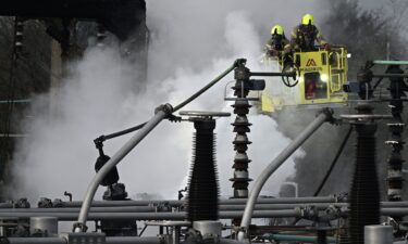 Airplanes remain parked on the tarmac at Heathrow International Airport after a nearby fire wiped out the power at the airport.