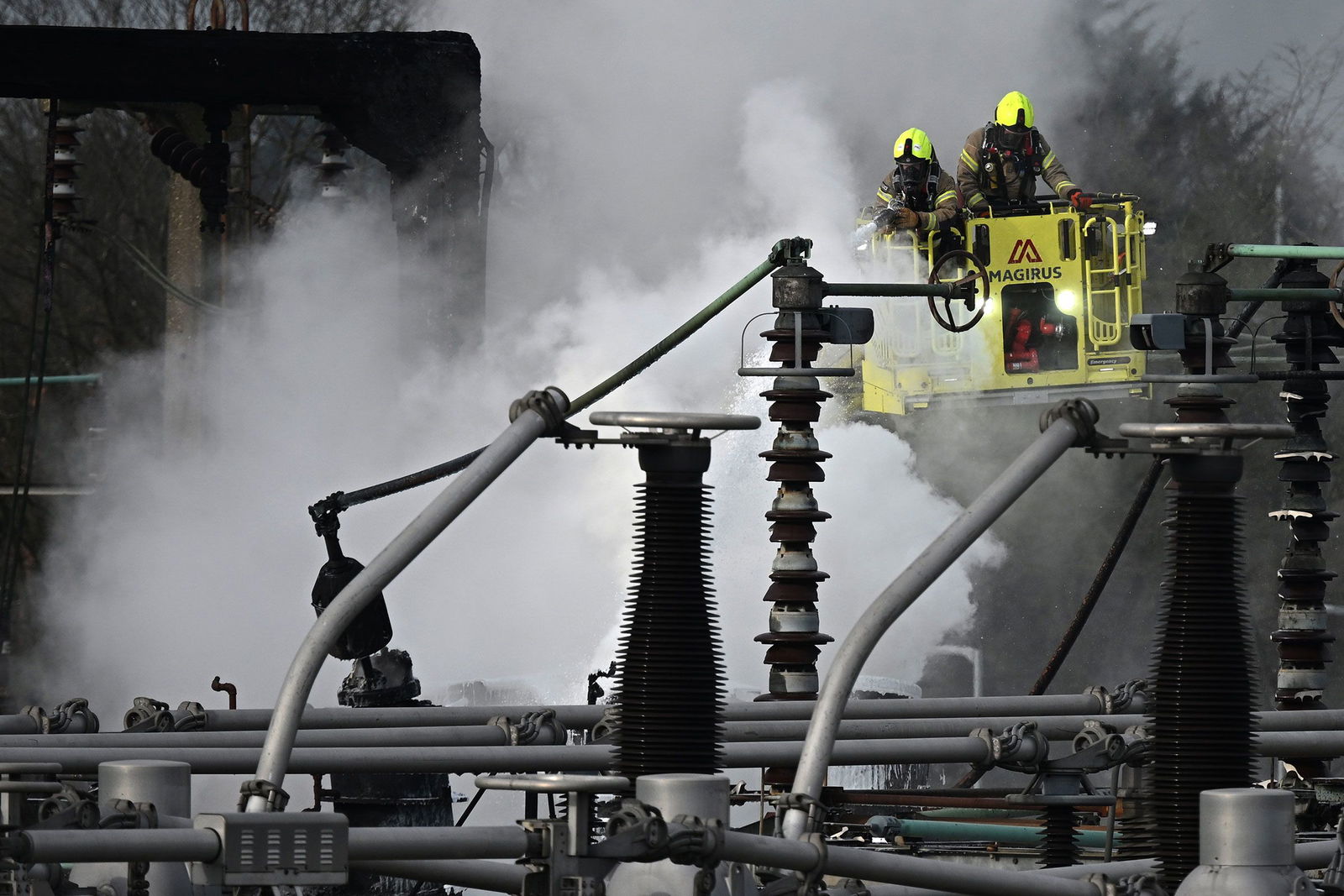 <i>Carlos Jasso/Reuters via CNN Newsource</i><br/>Airplanes remain parked on the tarmac at Heathrow International Airport after a nearby fire wiped out the power at the airport.