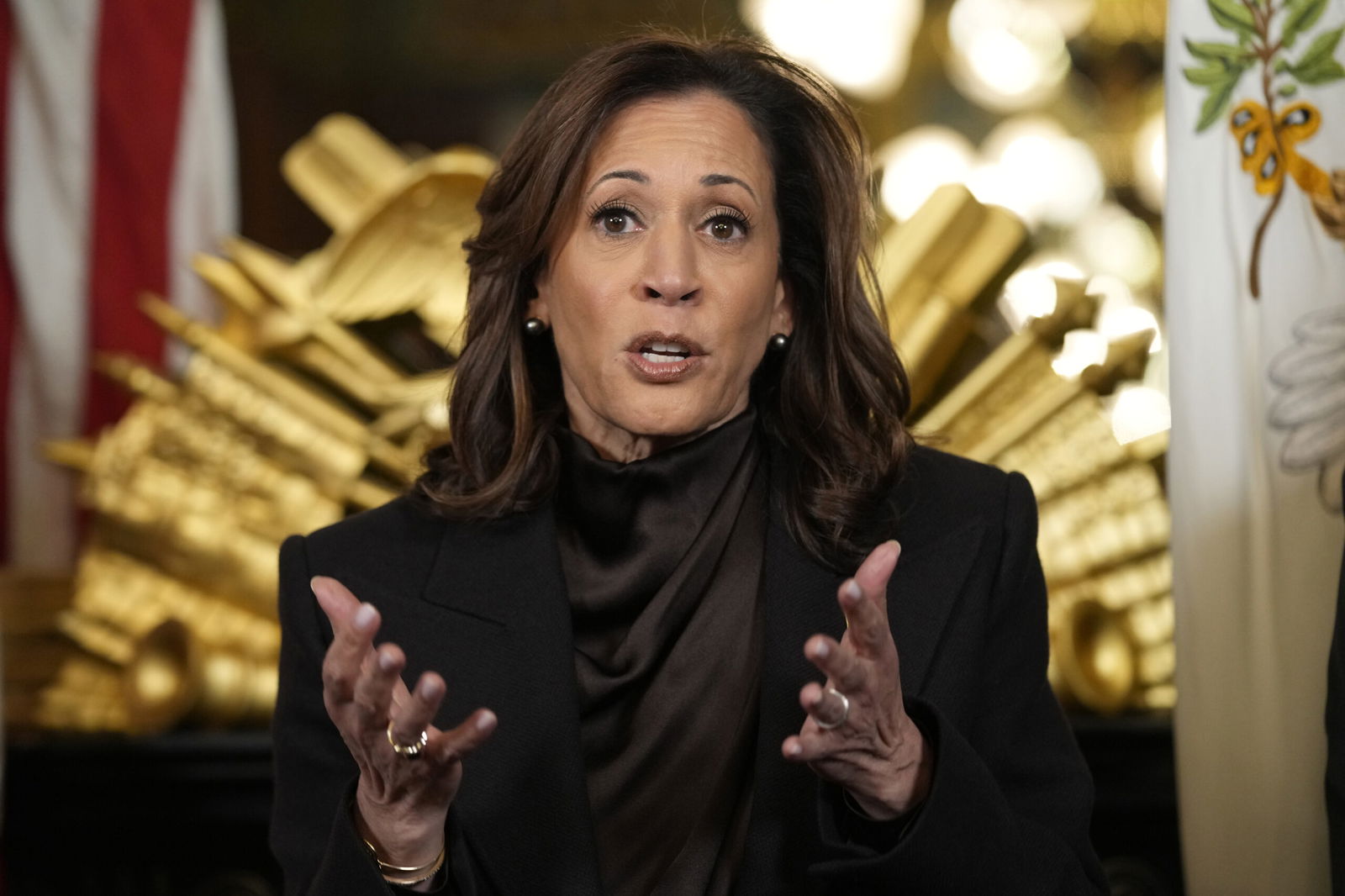 FILE - Vice President Kamala Harris speaks before signing the desk drawer in her ceremonial office