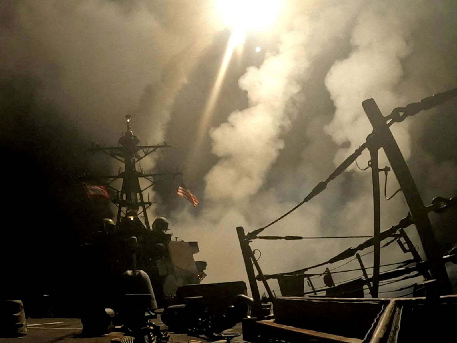 <i>US Central Command/Handout/Reuters via CNN Newsource</i><br/>A ship fires missiles at an undisclosed location after President Donald Trump launched military strikes against Yemen's Iran-aligned Houthis in this screengrab obtained from a handout video released on March 15.