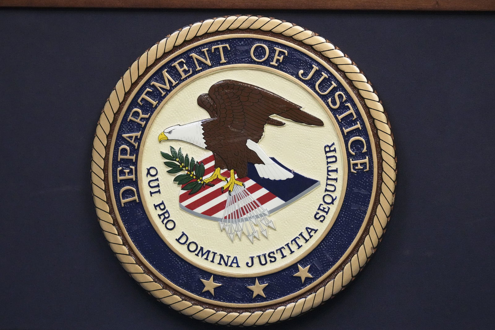 FILE - The Department of Justice seal is seen during a news conference Thursday
