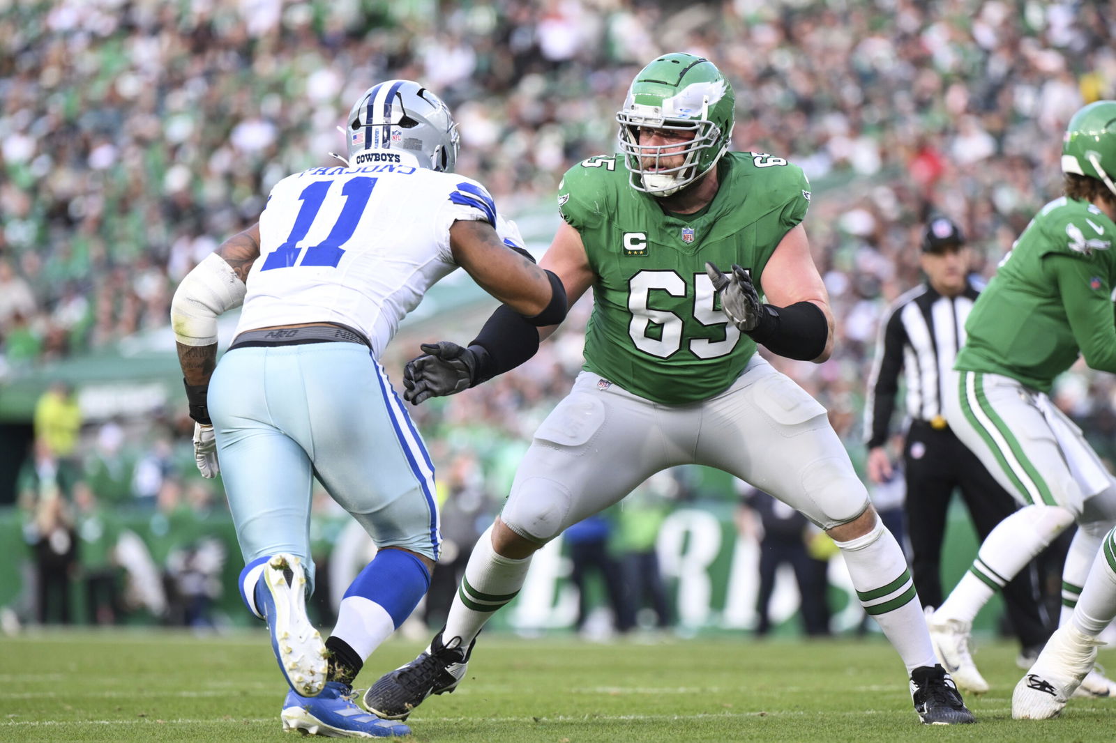 FILE - Philadelphia Eagles offensive tackle Lane Johnson (65) in action against Dallas Cowboys linebacker Micah Parsons (11) during the second half of an NFL football game