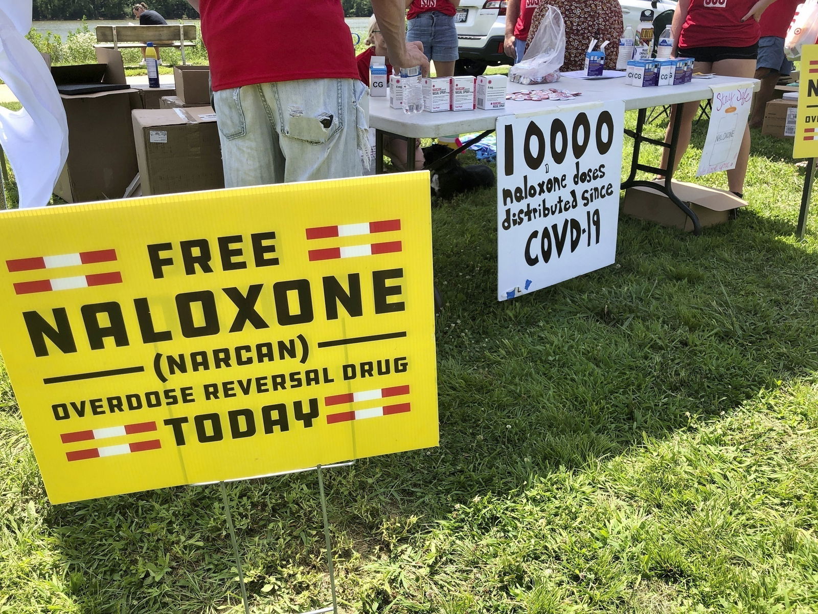 FILE - Signs are displayed at a tent during a health event on June 26
