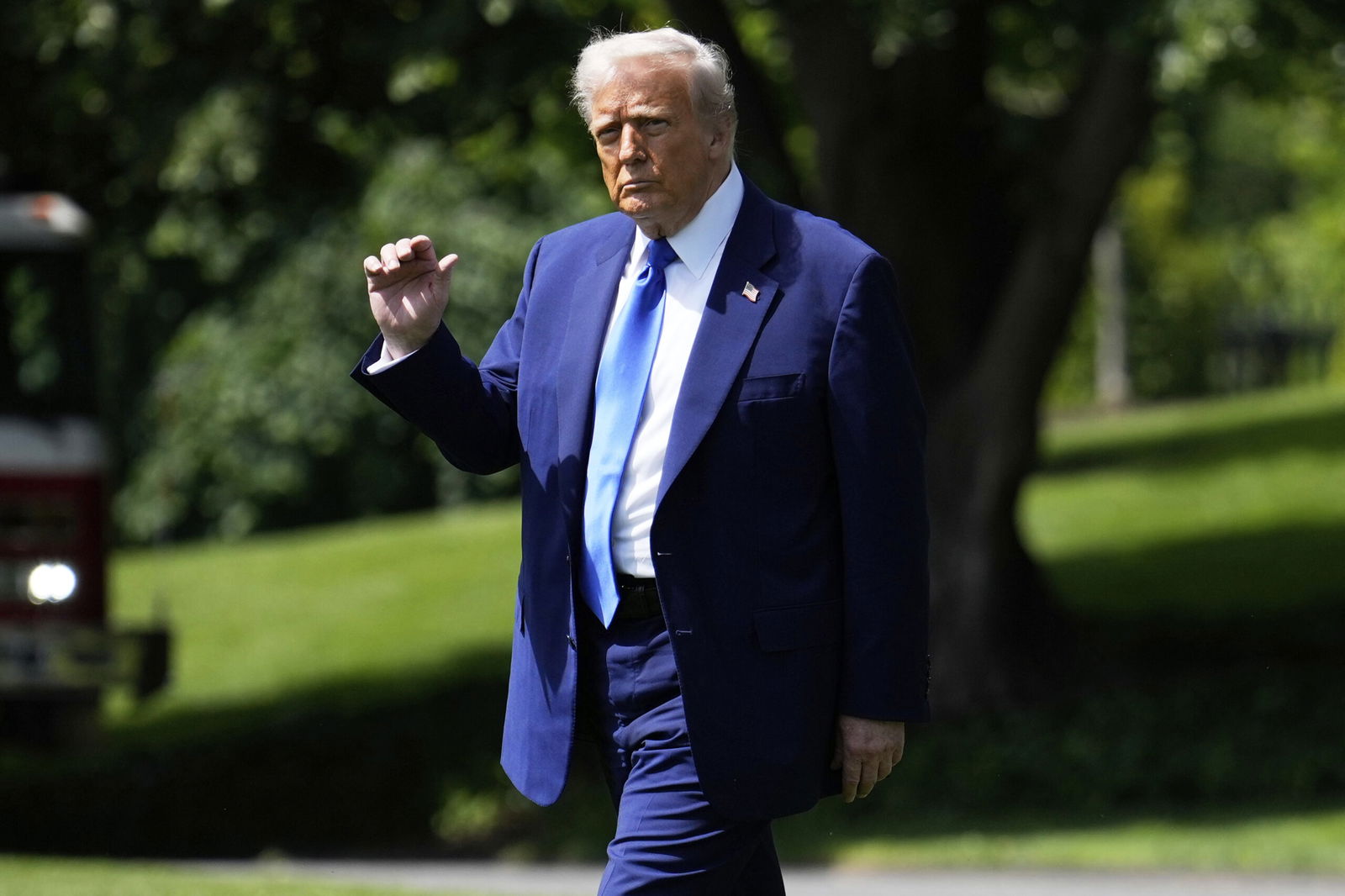 President Donald Trump walks across the South Lawn of the White House to board Marine One en route to Joint Base Andrews