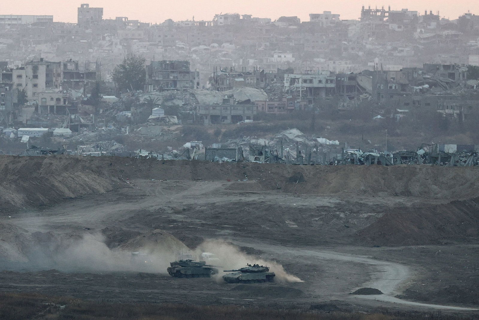 <i>Amir Cohen/Reuters via CNN Newsource</i><br/>Israeli tanks are pictured in Gaza on May 3.