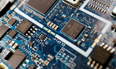 Semiconductor chips are seen on a circuit board of a computer in February 2022.