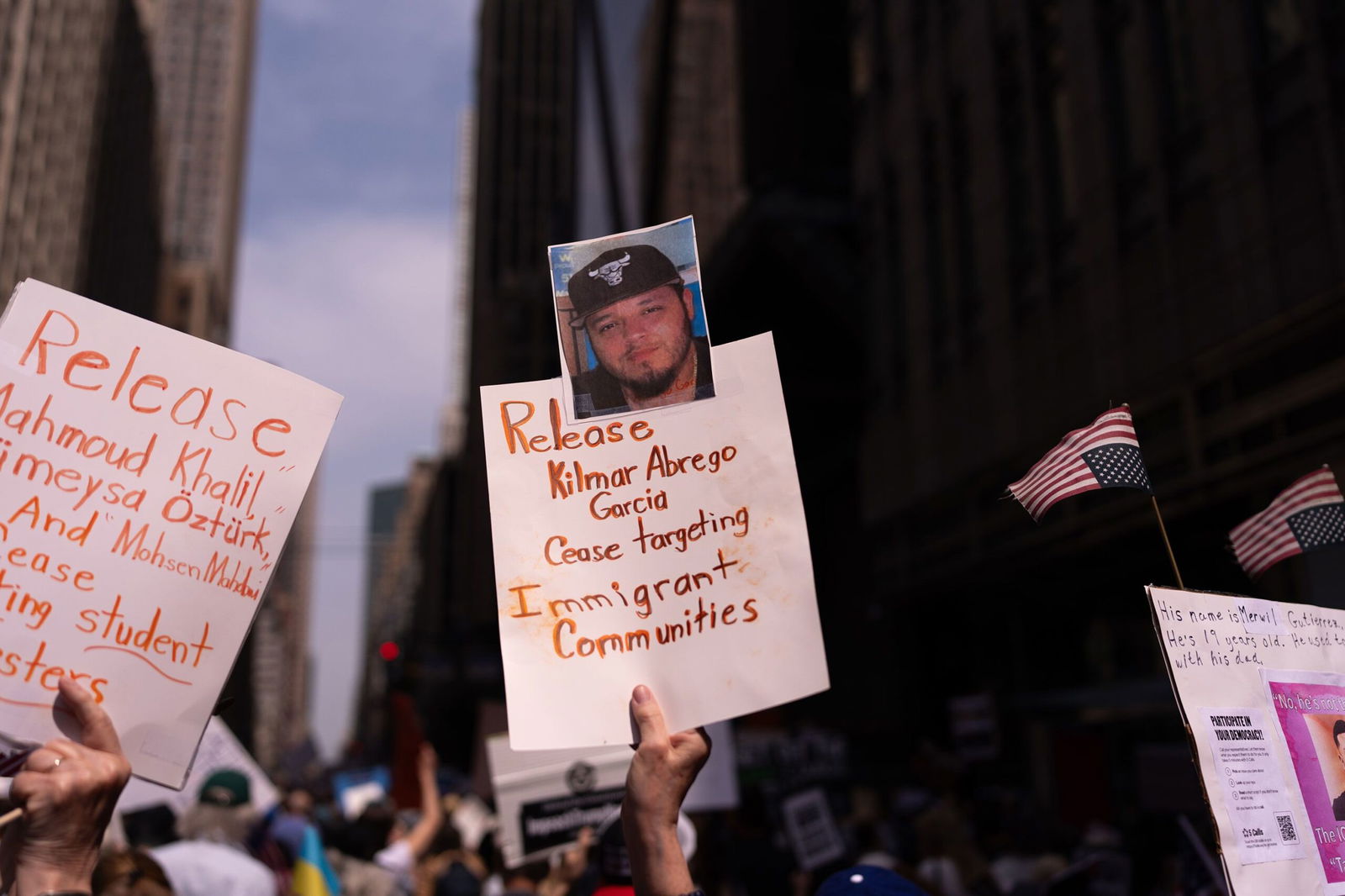 <i>Adam Gray/Getty Images via CNN Newsource</i><br/>A person holds a sign with a photo of Kilmar Abrego Garcia as people take part in a protest organised to 'Protect Migrants