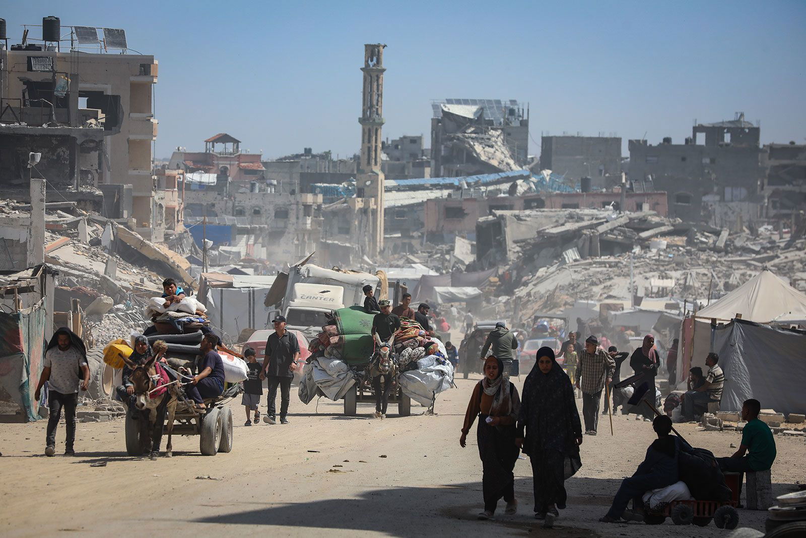 <i>Khames Alrefi/Anadolu/Getty Images via CNN Newsource</i><br/>Palestinians in the Gaza Strip flee with their possessions following intensified Israeli military attacks on May 16. The Israeli military says it has launched the first stages of a new major offensive in Gaza.