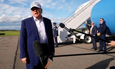 President Donald Trump speaks to reporters before boarding Air Force One in Morristown