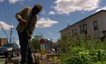Jay Webb tends the garden at the intersection where Floyd was murdered hopes something good can grow from painful memories.