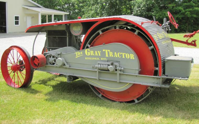 The Gray Drum Drive 22-40 was produced by the Gray Tractor Manufacturing Co. of Minneapolis in the early 1920s. Instead of traditional rear wheels, the 22-40 had two massive rotating drums intended to provide superior traction and reduced soil rutting, especially useful in sandy or marshy areas. The design was mechanically complex and difficult to maneuver, so the tractor was not commercially successful, and production ceased by the late 1920s. Surviving Gray Drum Drive tractors are extremely rare and highly prized by collectors.