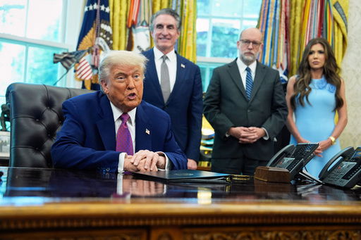President Donald Trump speaks to the media in the Oval Office at the White House