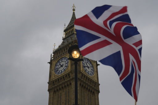 FILE - A Union flag is displayed outside the Houses of Parliament