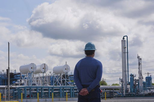 BKV Carbon Ventures health and safety advisor Adam Pope looks on at a compression station that is part of a carbon capture and sequestration process in Bridgeport