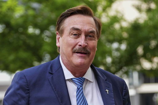 Mike Lindell walks into federal district court for a defamation trial on Thursday