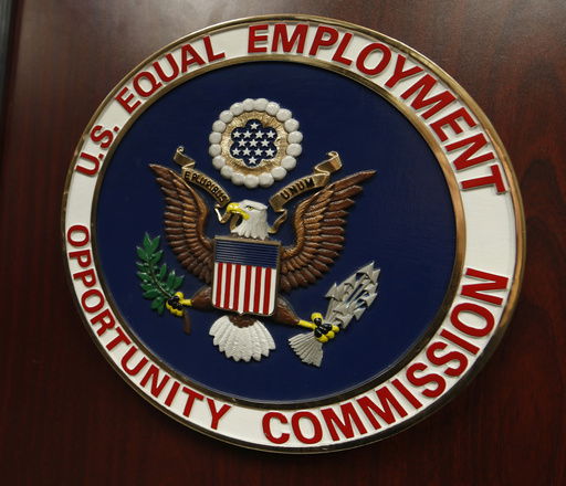 FILE - The emblem of the U.S. Equal Employment Opportunity Commission (EEOC) is shown on a podium in Vail