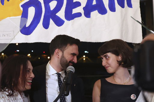 Democratic mayoral candidate Zohran Mamdani appears on stage with his family including his wife