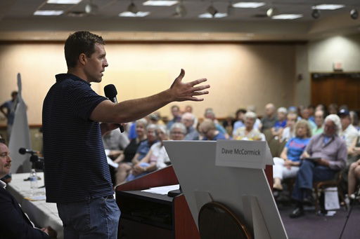 Conor Lamb speaks to the crowd at a town hall-style event organized by progressive groups at Central Penn College