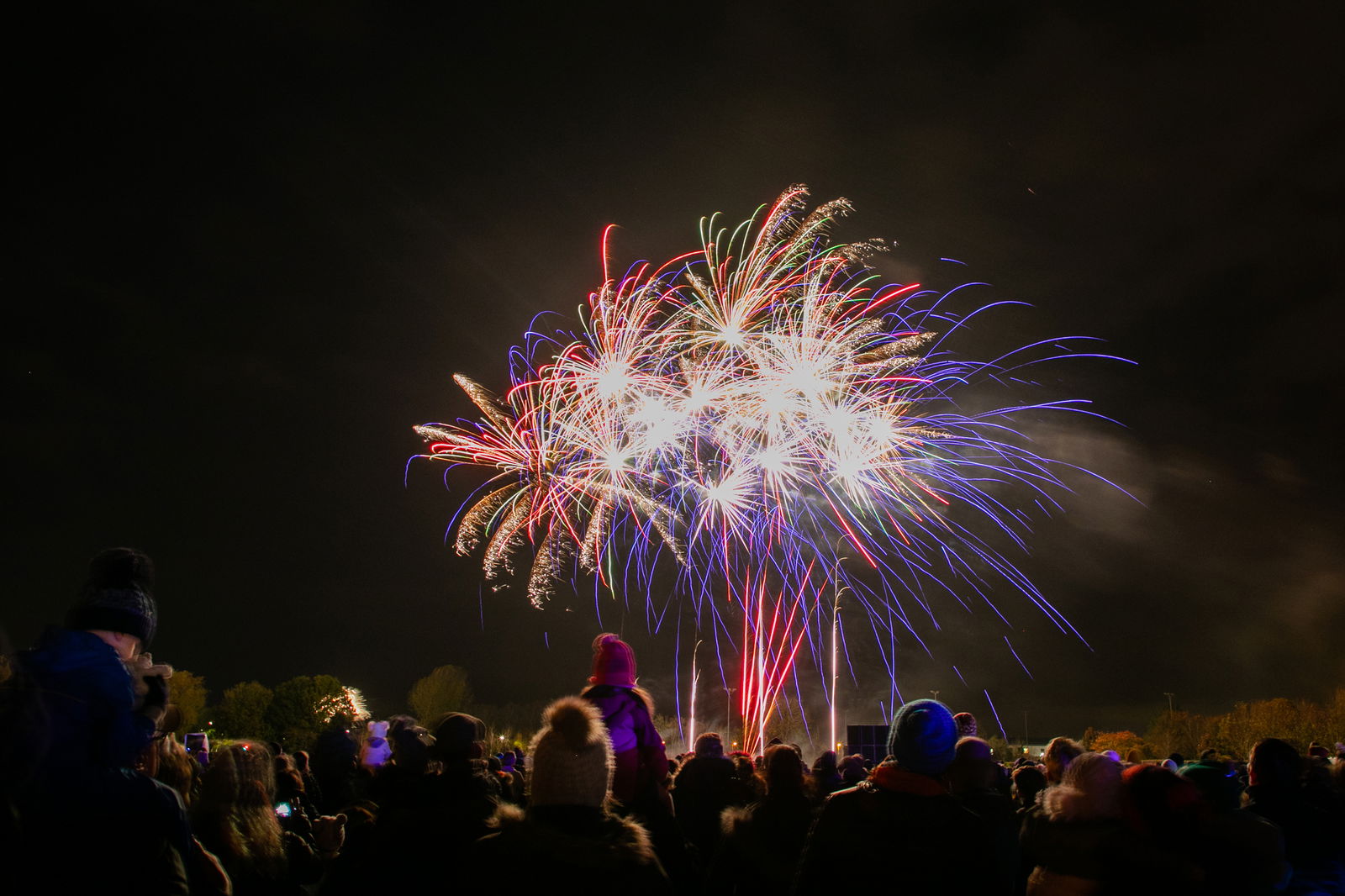 People watch a fireworks display.