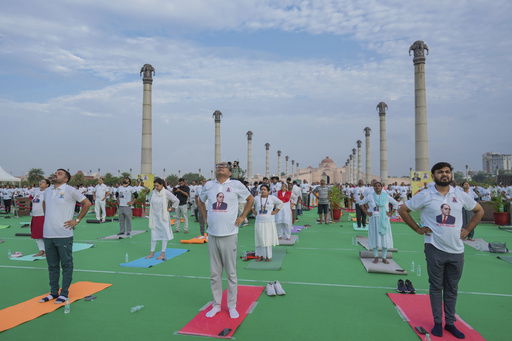 Indians perform yoga as they mark International Day of Yoga at Ambedkar Park