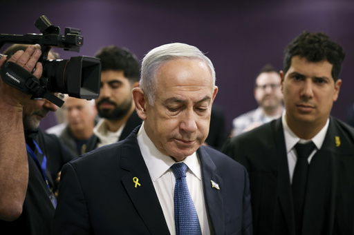 FILE - Israeli Prime Minister Benjamin Netanyahu attends his trial where he faces corruption charges at the district court in Tel Aviv