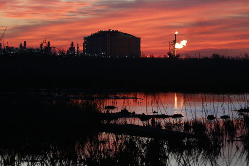FILE - A flare burns at Venture Global LNG in Cameron