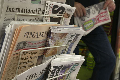 FILE - A newsstand is seen in central London on July 16