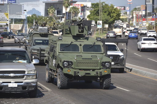 FILE - National Guards patrol the streets in Culiacan