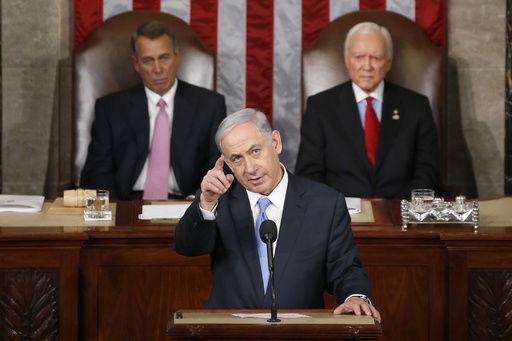 FILE - Israeli Prime Minister Benjamin Netanyahu gestures while speaking before a joint meeting of Congress on Capitol Hill in Washington