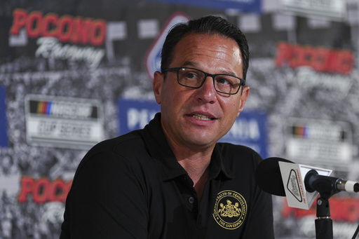 Pennsylvania Gov. Josh Shapiro talks to the media prior to a NASCAR Cup Series auto race at Pocono Raceway