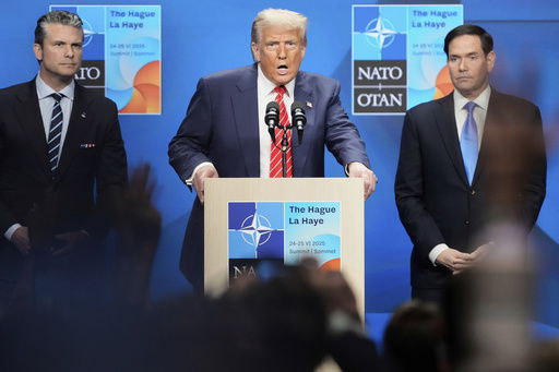 President Donald Trump speaks standing between Secretary of State Marco Rubio
