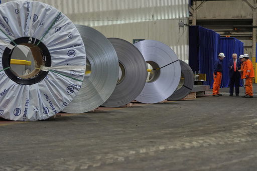 FILE - President Donald Trump talks to workers as he tours U.S. Steel Corporation's Mon Valley Works-Irvin plant