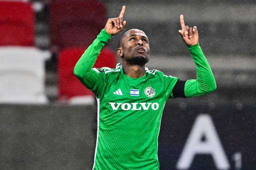 FILE - Maccabi Haifa's Gadi Kinda celebrates after scoring his side's second goal during the Europa Conference League round of 16 first leg soccer match between Maccabi Haifa and Fiorentina at the Boszik Arena in Budapest