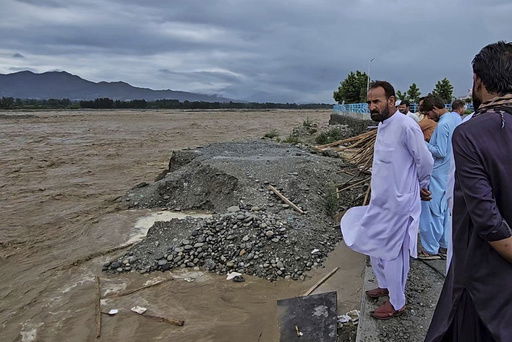 Local residents look to the Swat River
