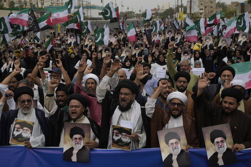 Shiite Muslims take part in a rally to condemn Israeli strikes on Iran