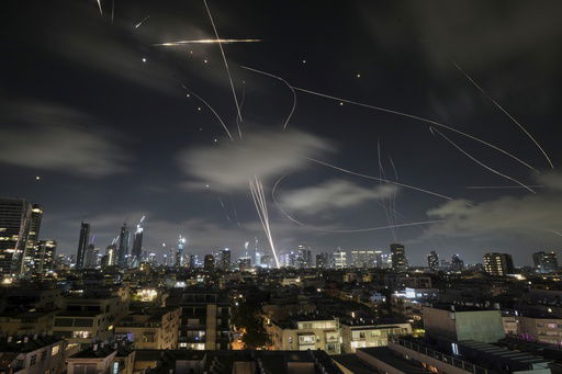 The Israeli Iron Dome air defense system fires to intercept missiles during an Iranian attack over Tel Aviv