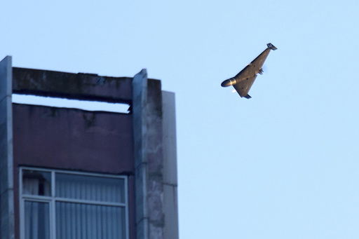 A Russian drone attacks a building during Russia's massive missile and drone air attack in Kyiv