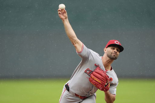 Cincinnati Reds starting pitcher Nick Martinez throws during the first inning of a baseball game against the Kansas City Royals