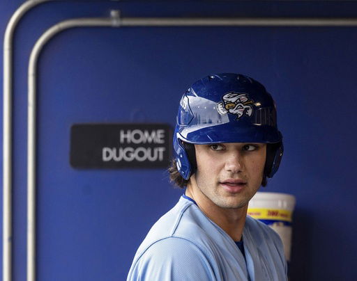 FILE - The Omaha Storm Chasers' Jac Caglianone waits in the dugout before his at-bat in a minor league baseball game against St. Paul at Werner Park in Papillion