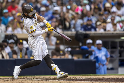 San Diego Padres' Fernando Tatis Jr. hits a home run in the seventh inning of a baseball game against the Kansas City Royals
